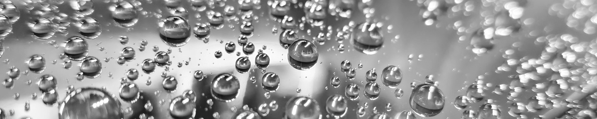 Detailing King premium car care product banner, hydrophobic water droplets on car paint surface